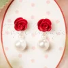 Oorbellen Met Roos En Parel In Ivoor